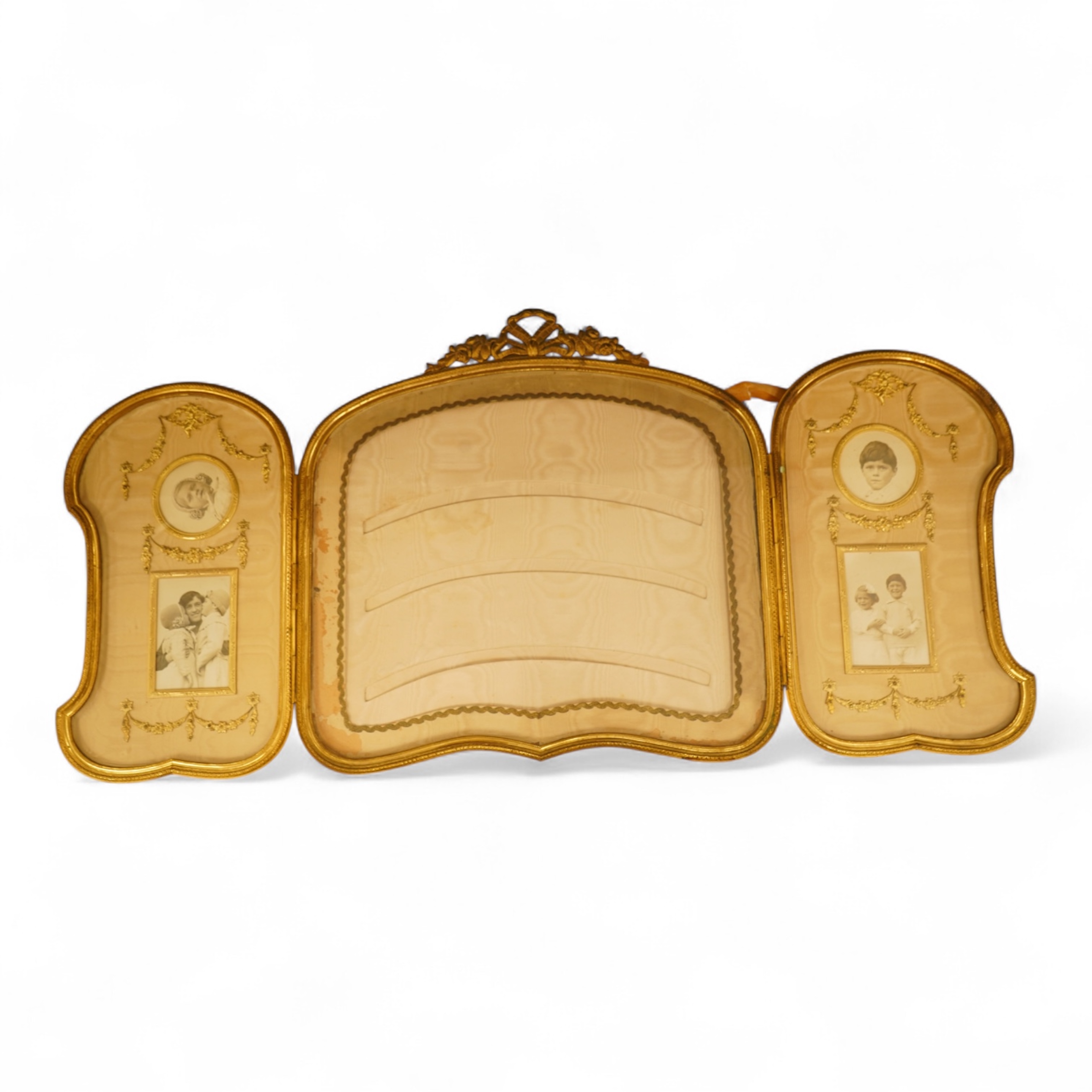An Edwardian gilt framed triptych photo frame with watered silk backing, overall 72cm wide